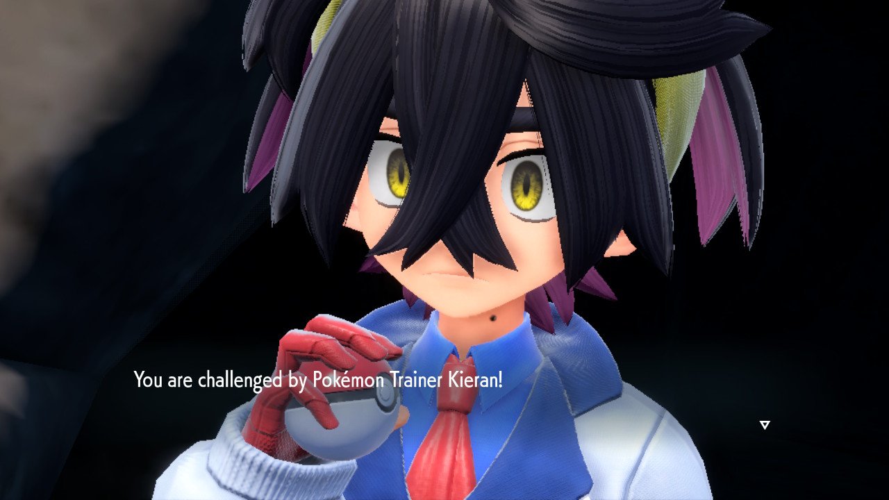 A screenshot of Pokémon Scarlet & Violet: The Teal Mask showing Kieran looking scary and holding a Poké Ball.  The text says 