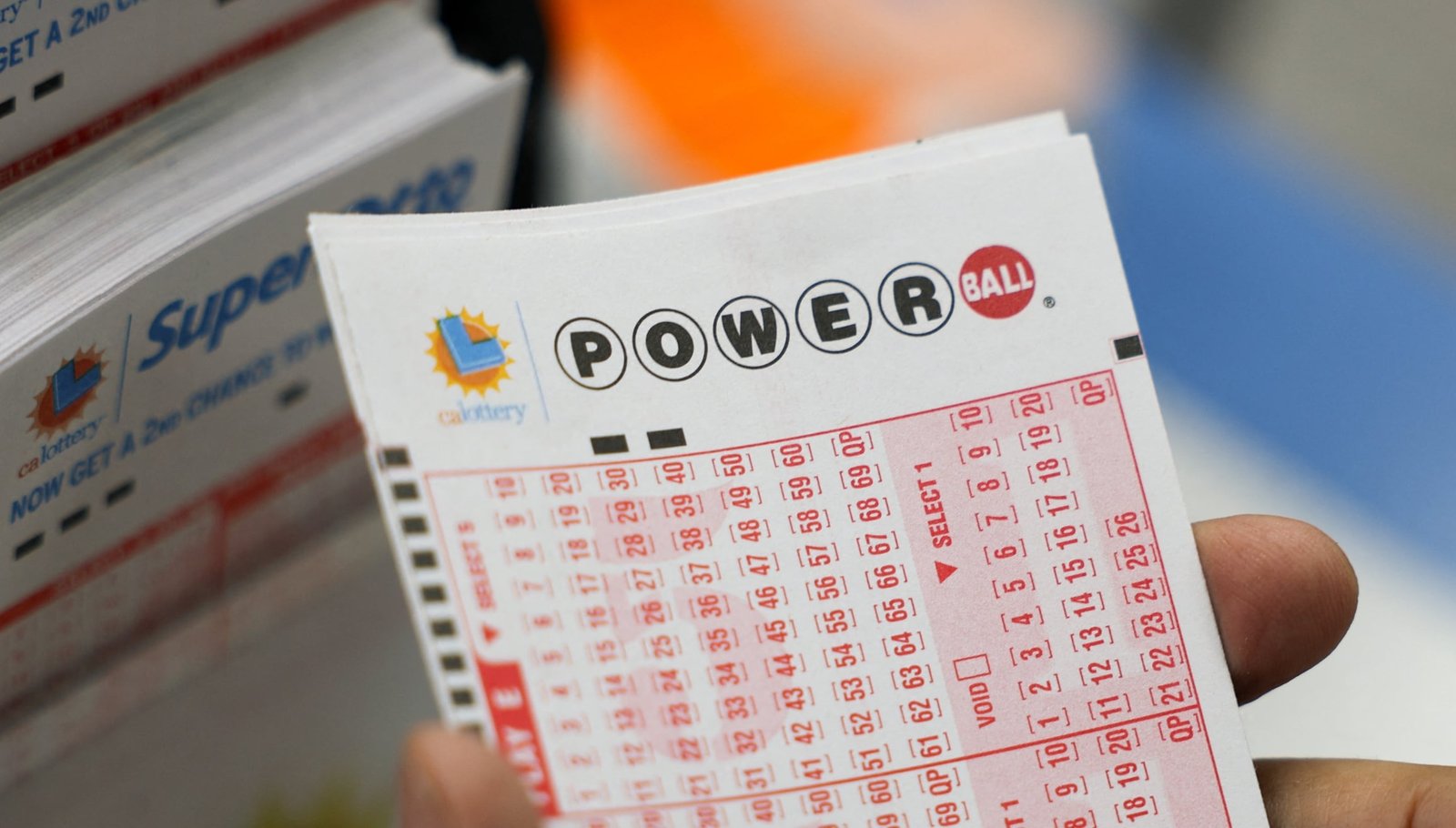 The Powerball mayor's award will be delivered by two happy winners (photo: AFP)