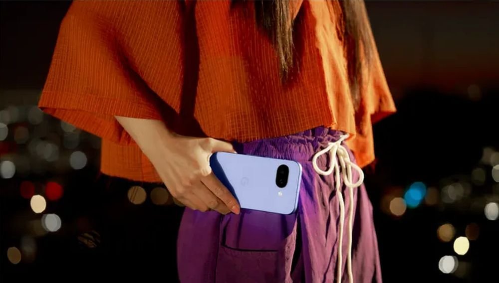 A man holds the Google Pixel 9a in blue to show its ergonomic size and convenience in daily use