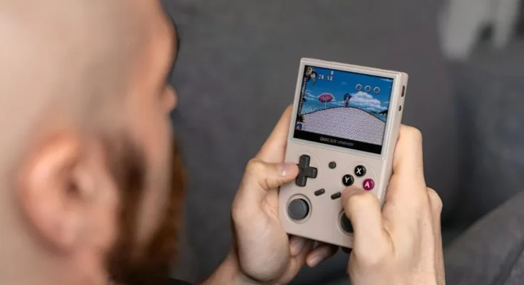 A black Analogue Pocket handheld console displaying the title screen of Super Mario Land in classic green monochrome.
