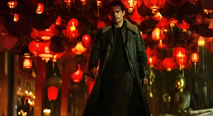 Henry Cavill wearing a trench coat and holding a sheathed katana in a cathedral setting for the Highlander reboot